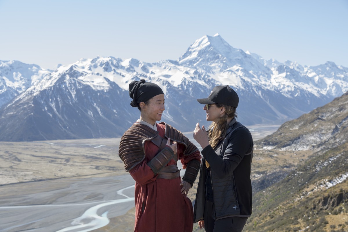 Disney's MULAN L to R: Yifei Liu (Mulan) on set with Director Niki Caro 